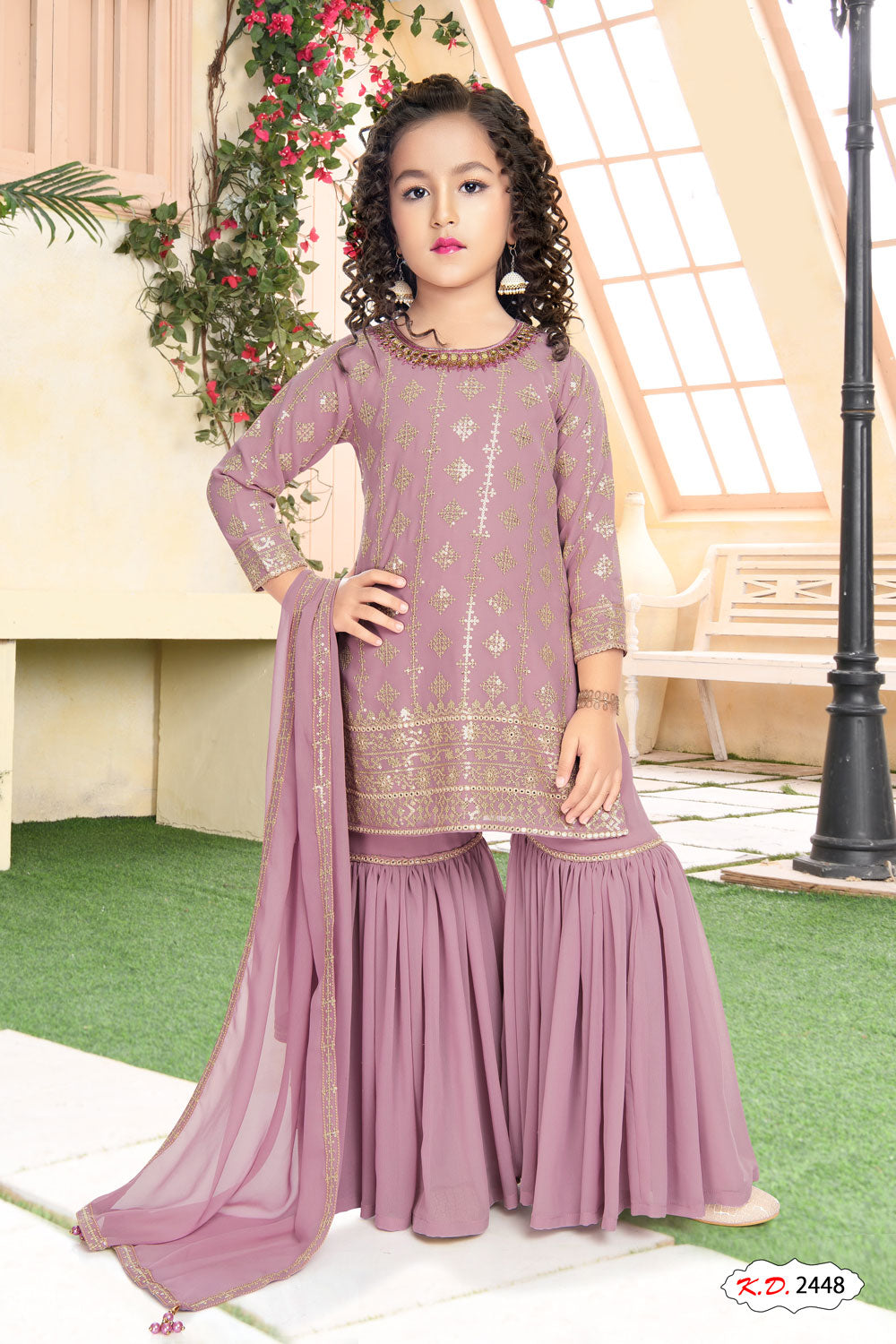 Pale pink color golden embroidered ethnic wear Sharara suit for girls.